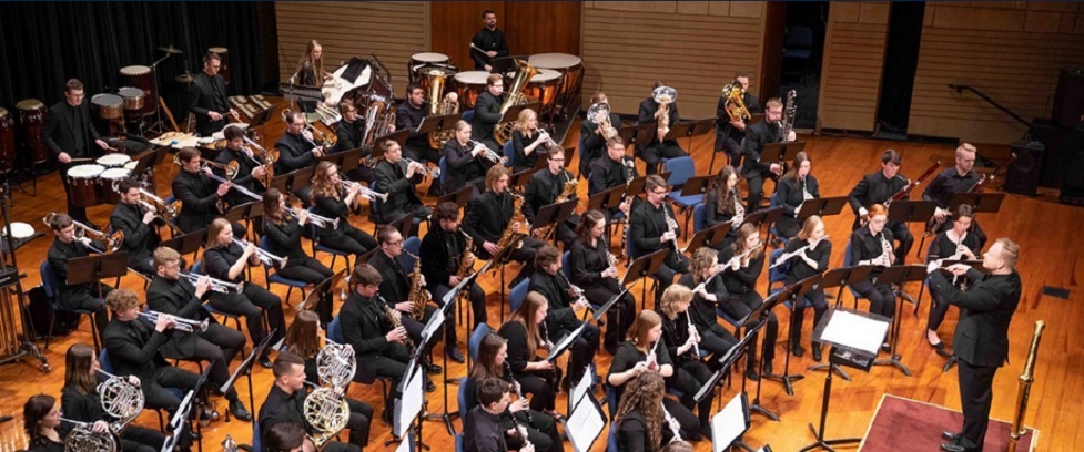 View of the wind symphony playing a concert.